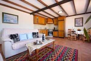 a living room with a couch and a table at Clara Suite 1 - Macaronesiahomes in Conil