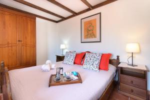 a bedroom with a bed with a tray on it at Clara Suite 1 - Macaronesiahomes in Conil +23 photos