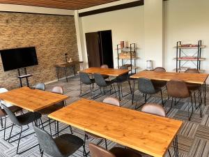 a room with tables and chairs and a flat screen tv at Iitoko - Vacation STAY 43906v in Iitoyo