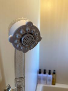 a close up of a shower head on a sink at ARASHIMA INN 203 / Vacation STAY 230 in Toba +11 photos