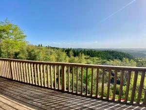 a wooden boardwalk with a view of a mountain at DeepSpot - Vacation STAY 19274v in Minamioguni +14 photos