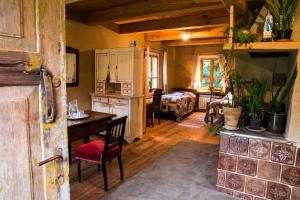 a kitchen and living room with a table and chairs at Siódmy Las in Zawada +43 photos