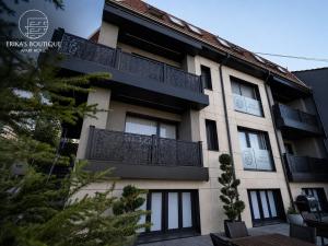a building with balconies on the side of it at Erika's Boutique Hotel in Prishtinë