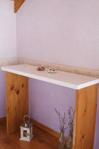 a kitchen island with a white counter top at An Dina House in Dina Huapi +49 photos