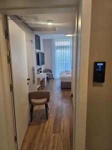 a hallway of a room with a bedroom and a bed at Zasavski Gurman in Dol pri Hrastniku