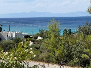 a view of the ocean from a beach at Natasa private garden apartment in Polychrono