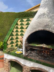 a pizza oven with a plate of food in it at Llar Montagut in Torredembarra
