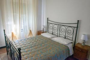 a bedroom with a bed and a window at B&B Da Beppe in Neirone