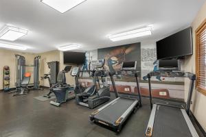 a gym with several treadmills and cardio machines at Best Western Plus Dubuque Hotel and Conference Center in Dubuque +72 photos