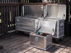 two metal trunks sitting on a wooden deck at Lost Cabin - Vacation STAY 89724v in Kamogawa
