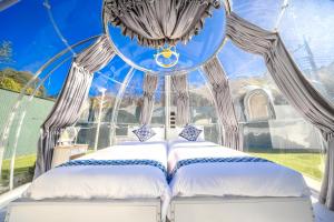 a bed in a gazebo with a window at Camp studio - Vacation STAY 89015v in Ichihara +83 photos