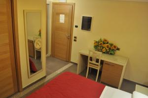 Postel nebo postele na pokoji v ubytování Aerhotel Phelipe