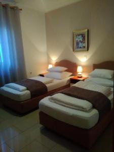 Postel nebo postele na pokoji v ubytování Guest house Garfild 2