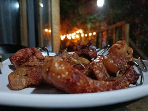 a white plate of food on a table at Kai Ecoglamping in El Peñol