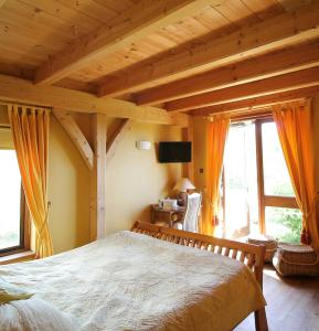a bedroom with a large bed in a house at Beautiful Stone Riverside Retreat Galway in Galway