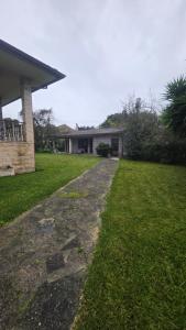 a house with a pathway leading to a yard at Oliveirinha, Aveiro, Portugal in Oliveirinha