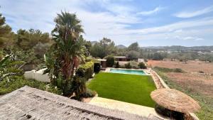 an image of a yard with a swimming pool at SERENITY pool Ibiza Villa in Santa Eularia des Riu