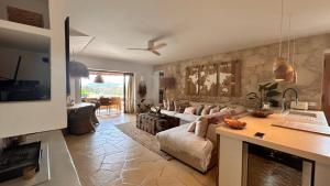a living room with a couch and a fireplace at SERENITY pool Ibiza Villa in Santa Eularia des Riu
