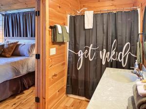 a bathroom with a shower and a sink in a room at Free Railroad Tix - secluded - Fire Pit and Outdoor Bed Swing in Talc Mountain