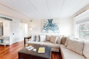 a living room with a couch and a table at White Marlin 202A in Ocean City
