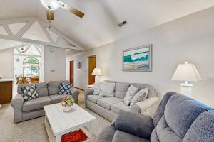 a living room with two couches and a table at Sunny Day in Ocean City