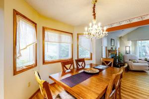 a dining room with a wooden table and a chandelier at Ocean Pines Fairway in Ocean Pines