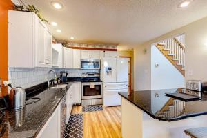a kitchen with white cabinets and a white refrigerator at Ocean Pines Fairway in Ocean Pines