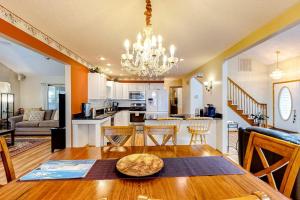 a kitchen and living room with a table and a dining room at Ocean Pines Fairway in Ocean Pines