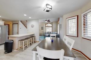 a kitchen and living room with a table and chairs at Trinity Place Treasure in Ocean Pines