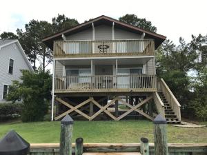 a large house with a wrap around deck at 14 Clipper on the Bay in Ocean Pines