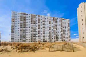 a large building on the beach next to the sand at Plaza 211 in Ocean City