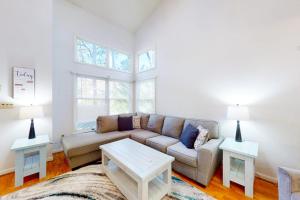 a living room with a couch and two tables at 5 Whitecap in Ocean Pines
