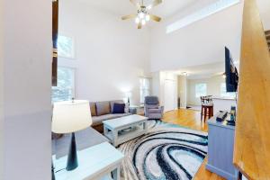 a living room with a couch and a table at 5 Whitecap in Ocean Pines