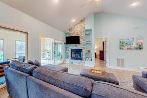 a living room with a couch and a fireplace at Turtle Shores in Ocean Pines