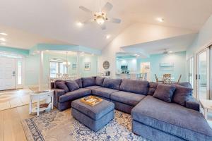 a large living room with a couch and a table at Turtle Shores in Ocean Pines
