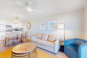 a living room with a couch and a table at Summer Beach 602 in Ocean City +17 photos