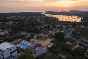 an aerial view of a small town with a sunset at Villa Suzanne in Banjole