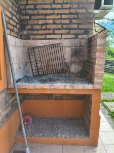 a brick oven with a metal grate on it at Cabaña 6D in Concordia