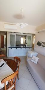 a living room with a couch and a table at Donna Rosa - Main Avenue in Taormina +49 photos