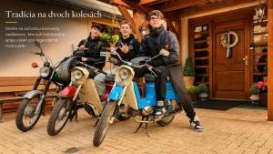 a group of men sitting on a motor scooter at Penzion Kormoran in Námestovo