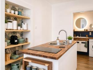 a kitchen with a sink and a counter top at Esther's Studio Keszthely in Keszthely