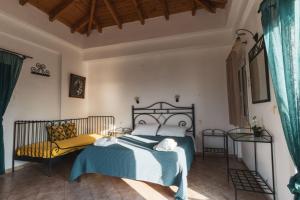 a bedroom with a bed with a teddy bear on it at Sunset elafonisos in Elafonisos