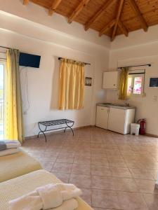 a living room with a couch and a table at Sunset elafonisos in Elafonisos +27 photos