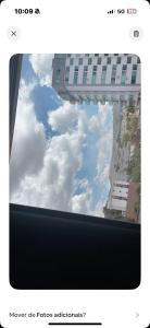 a view of the sky through a window at hotel larena in Sete Lagoas