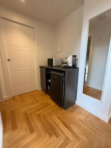 a room with a counter with a microwave and a door at La Fenice in Citta' Sant'Angelo