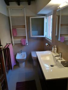 a bathroom with a sink and a toilet at Lo Chalet di Trastevere in Rome +25 photos