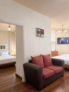 a living room with a couch and a bed at Regent Palace Hariz Hotel in Aley +39 photos