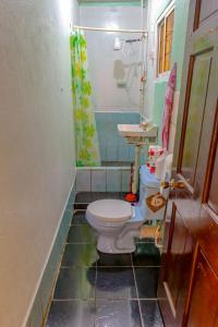 a bathroom with a toilet and a sink at SMITH'S BNB ROOMS in Georgetown +51 photos
