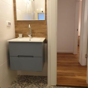 a bathroom with a sink and a mirror at Moonlight Suite Arad צימר אור הירח, ערד in Arad +12 photos