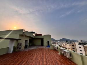 a balcony of a building with a view of the city at Hotel Golden Heights in Ajmer